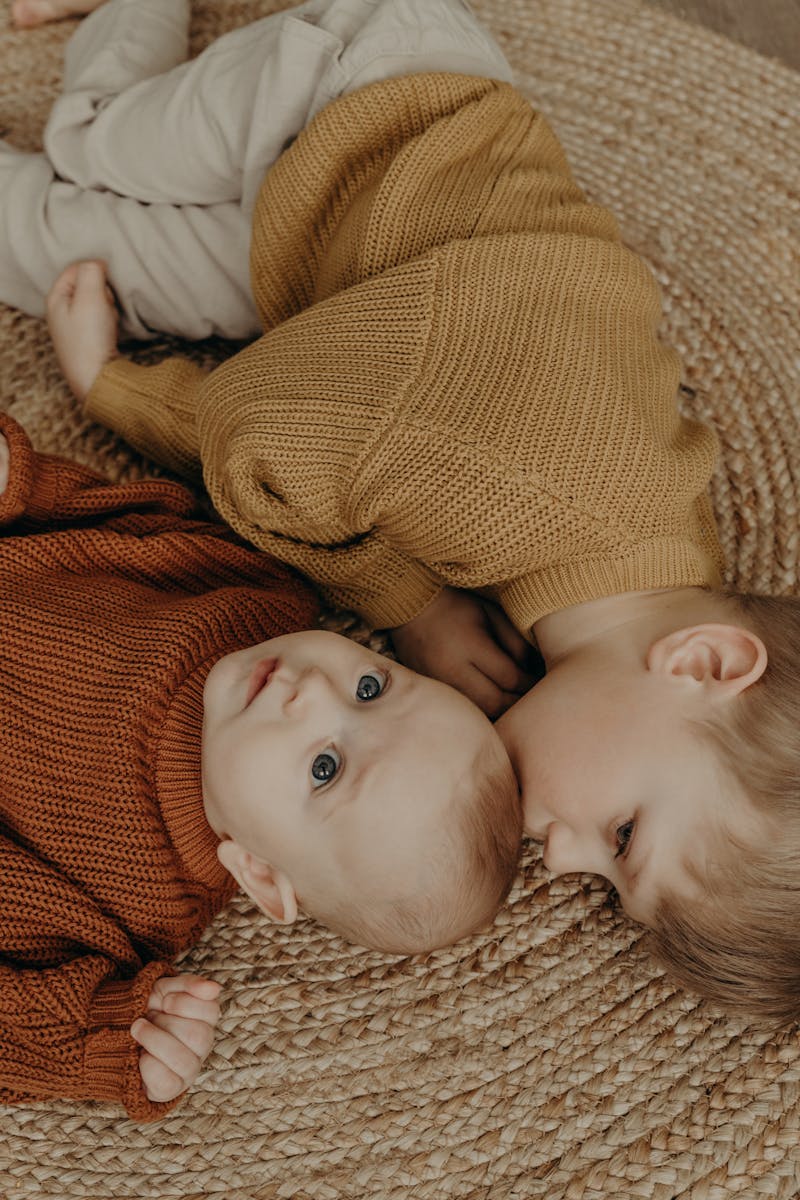 A Boy Kissing a Baby