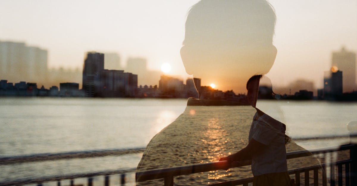 Silhouette of a Man on a Photo of a Woman Smiling on a Bridge