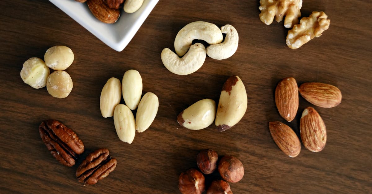 Variety of Brown Nuts on Brown Wooden Panel High-angle Photo