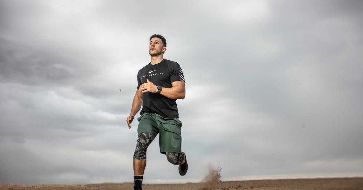 Man Running on Sand Field