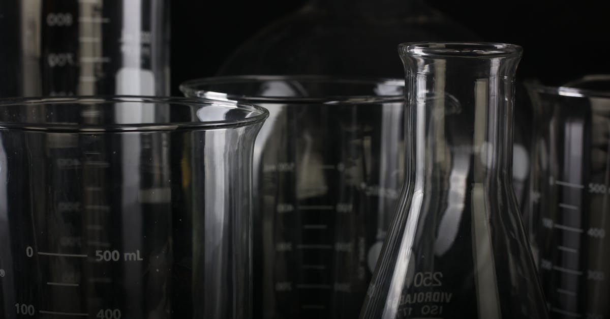 A detailed close-up of various transparent laboratory glassware used in scientific experiments.