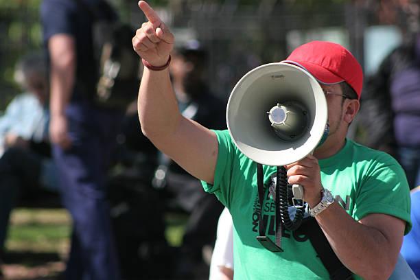protest Protester pointing finger and holding megaphone government censorship stock pictures, royalty-free photos & images